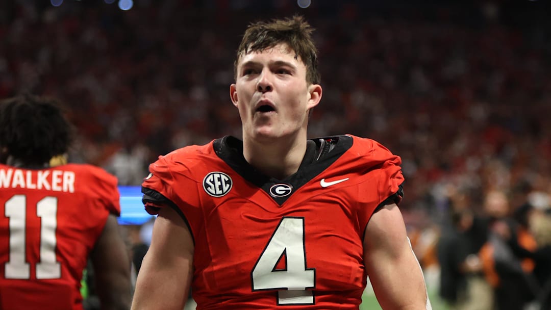 Dec 7, 2024; Atlanta, GA, USA; Georgia Bulldogs tight end Oscar Delp (4) reacts after defeating the Texas Longhorns in overtime in the 2024 SEC Championship game at Mercedes-Benz Stadium. Mandatory Credit: Brett Davis-Imagn Images