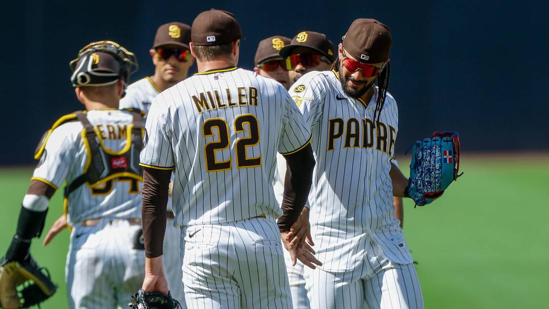 Jul 29, 2026; San Diego, California, USA; San Diego Padres relief pitcher Mason Miller (22) celebrates with right fielder Fernando Tatis Jr. (23) after defeating the Colorado Rockies at Petco Park. Mandatory Credit: David Frerker-Imagn Images