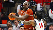 Jan 29, 2025; Oxford, Mississippi, USA; Texas Longhorns forward Arthur Kaluma (6) handles the ball as Mississippi Rebels guard Dre Davis (14) defends during the second half at The Sandy and John Black Pavilion at Ole Miss. Mandatory Credit: Petre Thomas-Imagn Images