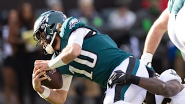 Jan 1, 2023; Philadelphia, Pennsylvania, USA; Philadelphia Eagles quarterback Gardner Minshew (10) is sacked by New Orleans Saints defensive end Carl Granderson (96) during the second quarter at Lincoln Financial Field. Mandatory Credit: Bill Streicher-Imagn Images