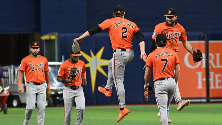 Aug 10, 2024; St. Petersburg, Florida, USA; Baltimore Orioles shortstop Gunnar Henderson (2) and  left fielder Colt Cowser (17) celebrate after defeating Tampa Bay Rays at Tropicana Field. Mandatory Credit: Jonathan Dyer-USA TODAY Sports