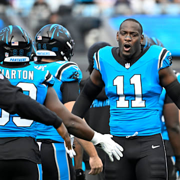 Oct 26, 2025; Charlotte, North Carolina, USA; Carolina Panthers linebacker Nic Scourton (11) runs on to the field before the game at Bank of America Stadium. Mandatory Credit: Bob Donnan-Imagn Images