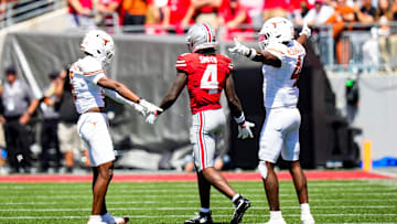 Texas Longhorns defensive backs Malik Muhammad and Jelani McDonald react after Ohio State wide receiver Jeremiah Smith dropped a pass 