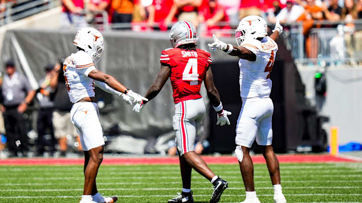 Texas Longhorns defensive backs Malik Muhammad and Jelani McDonald react after Ohio State wide receiver Jeremiah Smith dropped a pass 