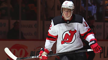 Mar 15, 2025; Pittsburgh, Pennsylvania, USA;  New Jersey Devils center Cody Glass (12) takes the ice against the Pittsburgh Penguins at PPG Paints Arena. Mandatory Credit: Charles LeClaire-Imagn Images