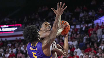 Nov 4, 2024; Athens, Georgia, USA; Georgia Bulldogs forward RJ Godfrey (10) looks rio shoot over Tennessee Tech Golden Eagles forward Rodney Johnson Jr. (5) during the first half at Stegeman Coliseum. Mandatory Credit: Dale Zanine-Imagn Images