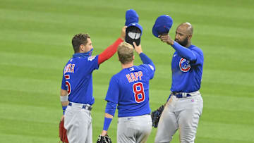 Aug 12, 2020; Cleveland, Ohio, USA; Chicago Cubs center fielder Albert Almora Jr. (5), center fielder Ian Happ (8) and right fielder Jason Heyward (22) celebrate a win over the Cleveland Indians at Progressive Field. Mandatory Credit: David Richard-Imagn Images