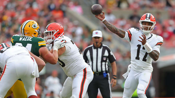 Cleveland Browns guard Zak Zinter (70) blocks Green Bay Packers defensive end Spencer Waege (64) as Cleveland Browns quarterback Dorian Thompson-Robinson (17) passes during the second half of an NFL preseason football game at Cleveland Browns Stadium, Saturday, Aug. 10, 2024, in Cleveland, Ohio.