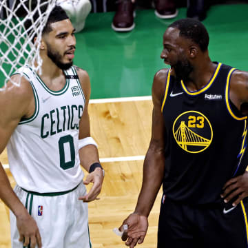 Jun 8, 2022; Boston, Massachusetts, USA; Boston Celtics forward Jayson Tatum (0) talks with Golden State Warriors forward Draymond Green (23) during the second quarter in game three of the 2022 NBA Finals at TD Garden. Mandatory Credit: Winslow Townson-USA TODAY Sports