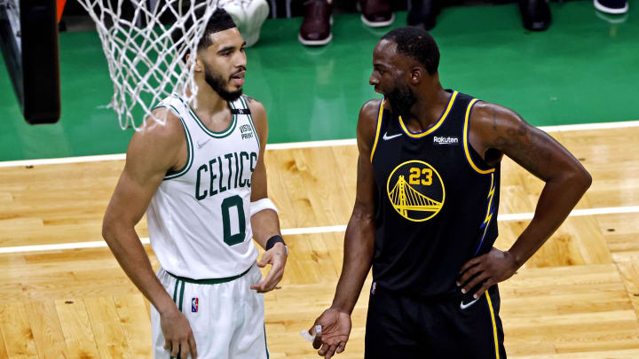 Jun 8, 2022; Boston, Massachusetts, USA; Boston Celtics forward Jayson Tatum (0) talks with Golden State Warriors forward Draymond Green (23) during the second quarter in game three of the 2022 NBA Finals at TD Garden. Mandatory Credit: Winslow Townson-USA TODAY Sports