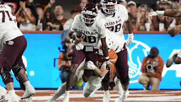 Texas A&M Aggies quarterback Marcel Reed (10) keeps the ball for yards during the first half against the Texas Longhorns at Darrell K Royal-Texas Memorial Stadium.
