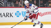 Feb 23, 2025; Pittsburgh, Pennsylvania, USA;  New York Rangers defenseman Adam Fox (23) handles the puck against the Pittsburgh Penguins during the first period at PPG Paints Arena. Mandatory Credit: Charles LeClaire-Imagn Images
