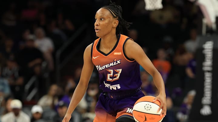 Jul 9, 2025; Phoenix, Arizona, USA; Phoenix Mercury guard Kiana Williams (23) against the Minnesota Lynx at PHX Arena. Mandatory Credit: Mark J. Rebilas-Imagn Images