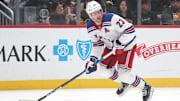 Feb 23, 2025; Pittsburgh, Pennsylvania, USA;  New York Rangers defenseman Adam Fox (23) handles the puck against the Pittsburgh Penguins during the first period at PPG Paints Arena. Mandatory Credit: Charles LeClaire-Imagn Images
