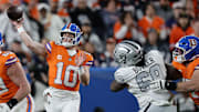 Nov 6, 2025; Denver, Colorado, USA; Denver Broncos quarterback Bo Nix (10) drops back to pass against the Las Vegas Raiders during the first half at Empower Field at Mile High. Mandatory Credit: Isaiah J. Downing-Imagn Images