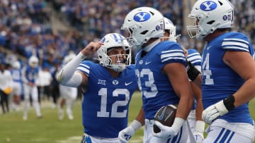 Quarterback Jake Retzlaff celebrates with Isaac Rex as the Cougars score a touchdown