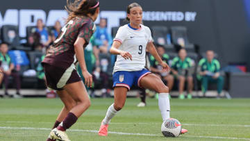 Jul 13, 2024; Harrison, New Jersey, USA; United States forward Mallory Swanson (9) plays the ball against Mexico defender Karen Luna (5) during the second half at Red Bull Arena. Mandatory Credit: Vincent Carchietta-USA TODAY Sports