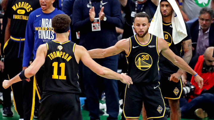 Golden State Warriors guard Stephen Curry (30) celebrates with guard Klay Thompson (11) after beating the Boston Celtics during game four of the 2022 NBA Finals at TD Garden.