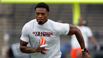 Dallas Cowboys defensive back Alijah Clark warms up with the Syracuse Orange.