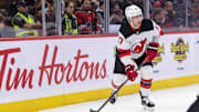Oct 17, 2024; Ottawa, Ontario, CAN; New Jersey Devils defenseman Simon Nemec (17) skates with the puck in the first period against the Ottawa Senators at the Canadian Tire Centre. Mandatory Credit: Marc DesRosiers-Imagn Images