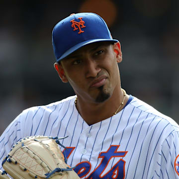 Edwin Diaz, of the Mets, is shown as he heads into the dugout after pitching the ninth inning.  Diaz gave up a two-run home-run during the inning.  The Mets went on to lose, 7-4.  Sunday, August 11, 2019