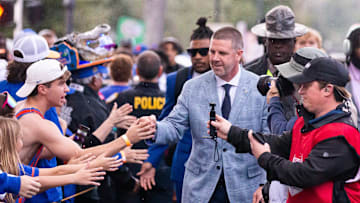 Florida Gators head coach Billy Napier gives fist bumps to fans during Gator Walk at Ben Hill Griffin Stadium in Gainesville, FL on Saturday, November 25, 2023 befoe the game against the Florida State Seminoles. [Doug Engle/Gainesville Sun]