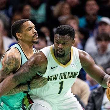 Jan 25, 2025; Charlotte, North Carolina, USA; New Orleans Pelicans forward Zion Williamson (1) controls the ball against Charlotte Hornets guard DaQuan Jeffries (3) during the second quarter at Spectrum Center. Mandatory Credit: Scott Kinser-Imagn Images