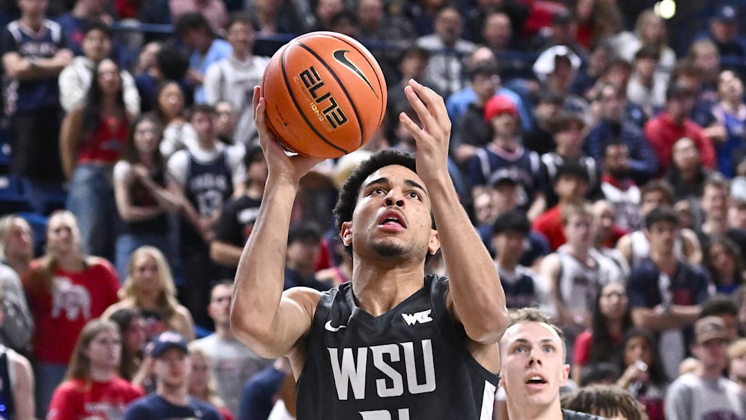 Feb 10, 2026; Spokane, Washington, USA; Washington State Cougars guard Ace Glass (21) shoots the ball against the Gonzaga Bulldogs in the second half  at McCarthey Athletic Center. Mandatory Credit: James Snook-Imagn Images