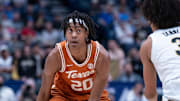 Texas Longhorns guard Tre Johnson (20) looks for an opening against Vanderbilt Commodores guard Tyler Tanner (3) during their first round game of the SEC Men's Basketball Tournament at Bridgestone Arena in Nashville, Tenn., Wednesday, March 12, 2025.