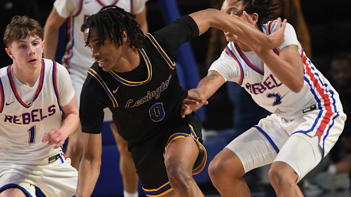 Lexington' s Kaleb Evans (0) dribbles through traffic against the Byrnes Rebels in a game last season.