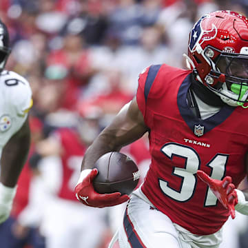 Oct 1, 2023; Houston, Texas, USA; Houston Texans running back Dameon Pierce (31) runs with the ball during the first quarter against the Pittsburgh Steelers at NRG Stadium. Mandatory Credit: Troy Taormina-Imagn Images