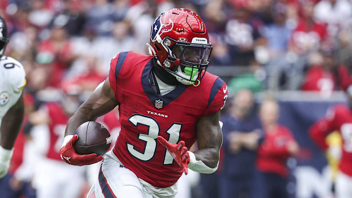 Oct 1, 2023; Houston, Texas, USA; Houston Texans running back Dameon Pierce (31) runs with the ball during the first quarter against the Pittsburgh Steelers at NRG Stadium. Mandatory Credit: Troy Taormina-Imagn Images