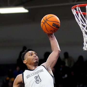 January 23, 2025; Goodyear, Ariz.; USA; Millennium forward Cameron Holmes (3) dunks against Sunnyslope during a game at Millennium High School.