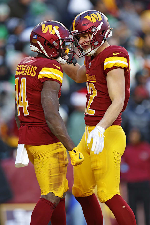 Washington Commanders wide receiver Olamide Zaccheaus celebrates with Washington Commanders wide receiver Luke McCaffrey