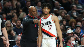 Jan 19, 2023; Portland, Oregon, USA;  Portland Trail Blazers head coach Chauncey Billups talks with guard Shaedon Sharpe (17) during a break in the action on a game against the Philadelphia 76ers in the first half at Moda Center. Mandatory Credit: Jaime Valdez-Imagn Images