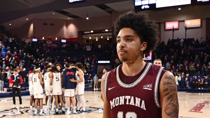 Dec 20, 2022; Spokane, Washington, USA; Montana Grizzlies guard Brandon Whitney (12) walks off the court after a game against the Gonzaga Bulldogs at McCarthey Athletic Center. Gonzaga won 85-75. Mandatory Credit: James Snook-USA TODAY Sports