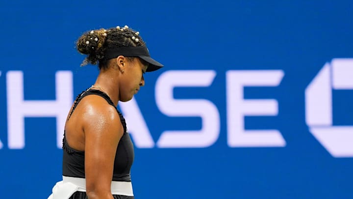 Aug 29, 2024; Flushing, NY, USA;  Naomi Osaka (JPN) tosses her racquet after a missed shot to Karolina Muchova (CZE) on day four of the 2024 U.S. Open tennis tournament at USTA Billie Jean King National Tennis Center. Mandatory Credit: Robert Deutsch-Imagn Images