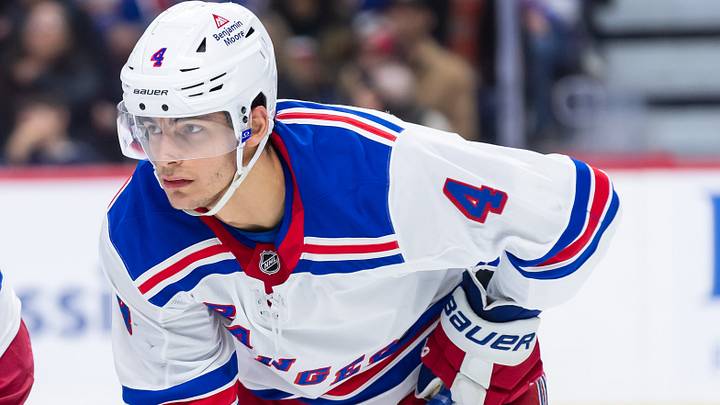 Mar 8, 2025; Ottawa, Ontario, CAN;  New York Rangers defenseman Braden Schneider (4) gets in position for a faceoff in the first period against the Ottawa Senators at the Canadian Tire Centre.