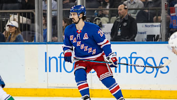 Mar 22, 2025; New York, New York, USA; New York Rangers left wing Chris Kreider (20) skates against the Vancouver Canucks during the first period at Madison Square Garden. Mandatory Credit: Danny Wild-Imagn Images