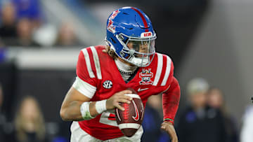 Jan 2, 2025; Jacksonville, FL, USA; Mississippi Rebels quarterback Jaxson Dart (2) drops back to pass against the Duke Blue Devils in the second quarter  during the Gator Bowl at EverBank Stadium. Mandatory Credit: Nathan Ray Seebeck-Imagn Images