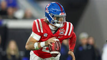 Mississippi Rebels quarterback Jaxson Dart (2) drops back to pass against the Duke Blue Devils in the second quarter  during the Gator Bowl at EverBank Stadium. 