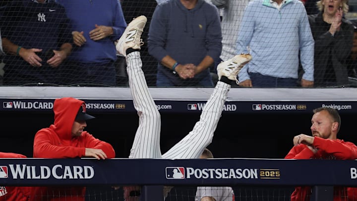 Oct 2, 2025; Bronx, New York, USA; New York Yankees third baseman Ryan McMahon (19) falls into the Boston Red Sox dugout after making a catch of a popup in the eighth inning during game three of the Wildcard round for the 2025 MLB playoffs at Yankee Stadium. Mandatory Credit: Vincent Carchietta-Imagn Images Oct 2, 2025; Bronx, New York, USA; New York Yankees third baseman Ryan McMahon (19) falls into the Boston Red Sox dugout after making a catch of a popup in the eighth inning during game three of the Wildcard round for the 2025 MLB playoffs at Yankee Stadium. Mandatory Credit: Vincent Carchietta-Imagn Images