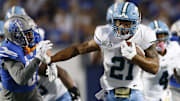 Oct 13, 2023; Memphis, Tennessee, USA; Tulane Green Wave running back Makhi Hughes (21) runs with the ball during the first half against the Memphis Tigers at Simmons Bank Liberty Stadium. Mandatory Credit: Petre Thomas-Imagn Images