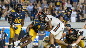 October 7, 2023; Berkeley, California, USA; Oregon State Beavers running back Damien Martinez (6) scores a touchdown against California Golden Bears defensive back Patrick McMorris (9) during the fourth quarter at California Memorial Stadium. Mandatory Credit: Kyle Terada-Imagn Images