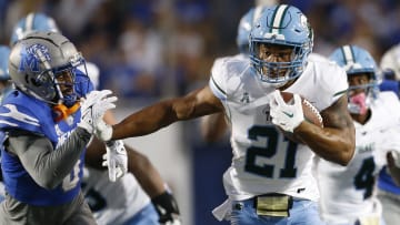 Oct 13, 2023; Memphis, Tennessee, USA; Tulane Green Wave running back Makhi Hughes (21) runs with the ball during the first half against the Memphis Tigers at Simmons Bank Liberty Stadium. Mandatory Credit: Petre Thomas-USA TODAY Sports