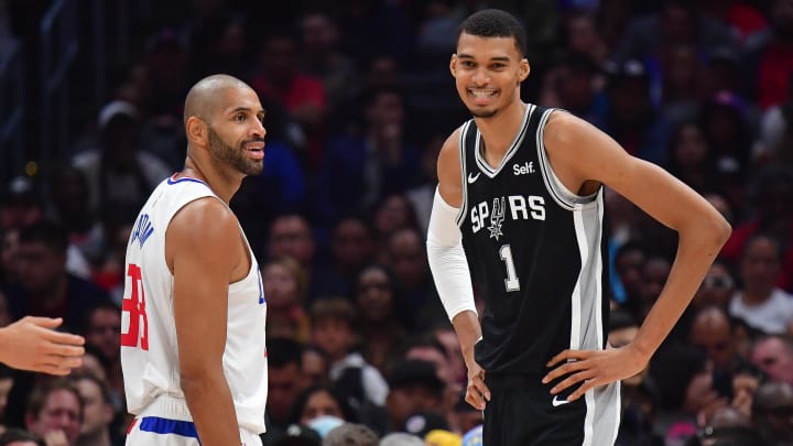 Oct 29, 2023; Los Angeles, California, USA; San Antonio Spurs center Victor Wembanyama (1) with Los Angeles Clippers forward Nicolas Batum (33) during the first half at Crypto.com Arena. Mandatory Credit: Gary A. Vasquez-USA TODAY Sports