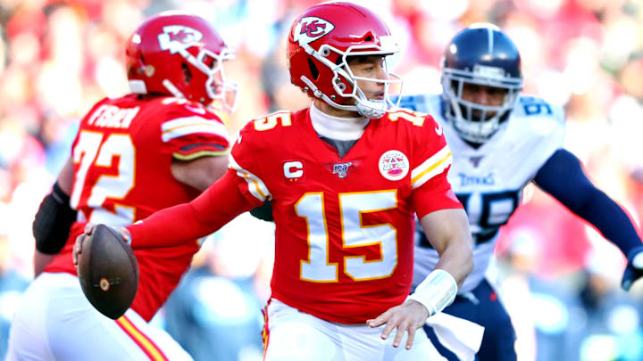  Kansas City Chiefs quarterback Patrick Mahomes (15) throws a pass against Tennessee Titans defensive tackle Jeffery Simmons (98) during the first half in the AFC Championship Game at Arrowhead Stadium.