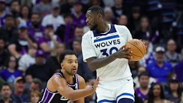 Oct 24, 2024; Sacramento, California, USA; Minnesota Timberwolves forward Julius Randle (30) controls the ball against Sacramento Kings forward Trey Lyles (41) during the second quarter at Golden 1 Center. Mandatory Credit: Sergio Estrada-Imagn Images