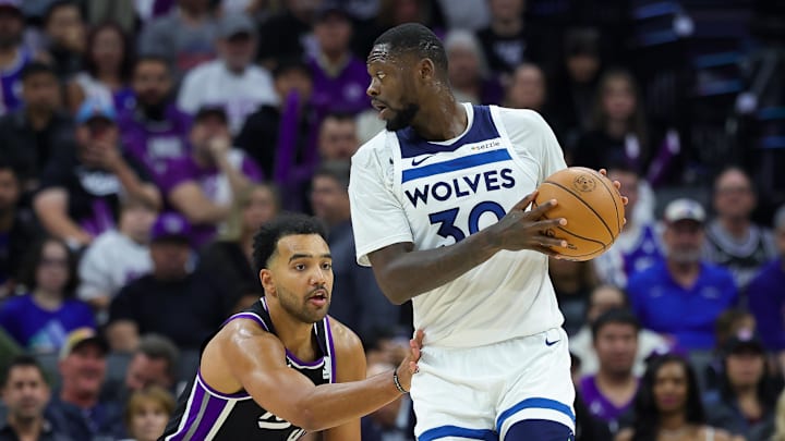 Oct 24, 2024; Sacramento, California, USA; Minnesota Timberwolves forward Julius Randle (30) controls the ball against Sacramento Kings forward Trey Lyles (41) during the second quarter at Golden 1 Center. Mandatory Credit: Sergio Estrada-Imagn Images