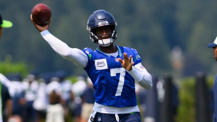 Jul 27, 2024; Renton, WA, USA; Seattle Seahawks quarterback Geno Smith (7) passes the ball during training camp at Virginia Mason Athletic Center. Mandatory Credit: Steven Bisig-USA TODAY Sports